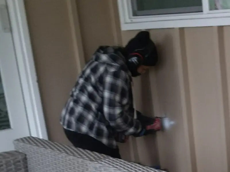 Professional electrician installing an exterior outlet in Cairo