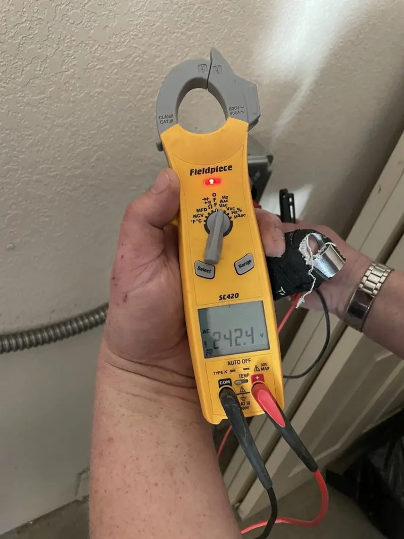 Voltage testing with clamp meter during Whole House Surge Protector in Cairo